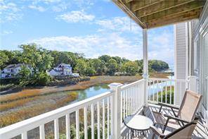 Stunning water views define this two bedroom, in town condo with elevator and balconies on each of three levels overlooking the Sound and Audubon Sanctuary.