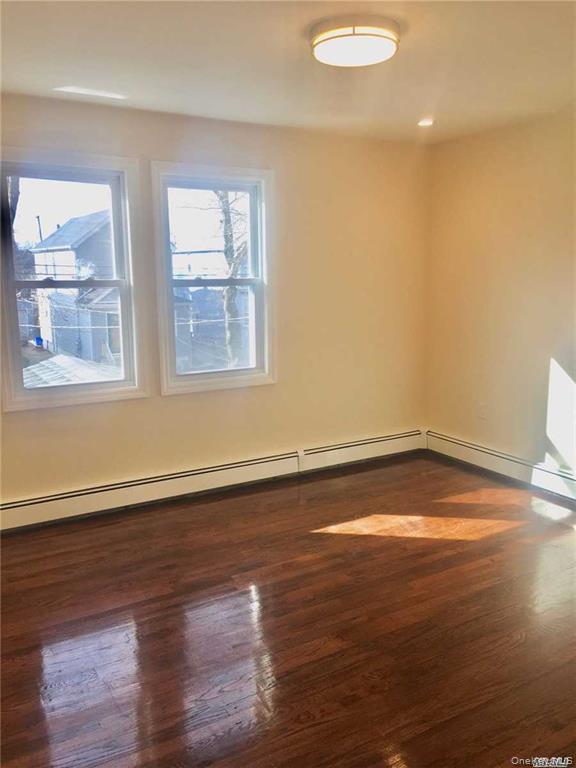 Refinished wood-finish flooring with a glossy sheen
