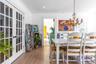 Dining area featuring crown molding, light wood-type flooring, a chandelier, and recessed lighting