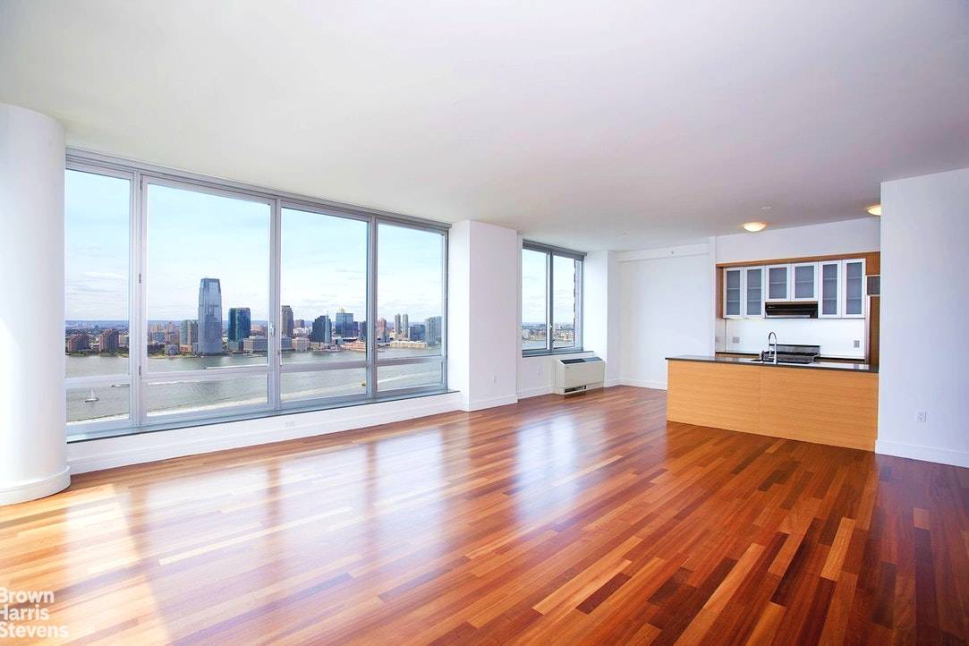 VIEWS, VIEWS, VIEWS ! Enjoy absolutely spectacular, panoramic views of the Hudson River and Statue of Liberty from this sprawling 2, 097 square foot apartment with floor to ceiling windows ...