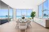 Dining area is surrounded by 11 foot impact glass windows and sliders