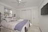 Bedroom with baseboard heating, recessed lighting, a closet, and a ceiling fan