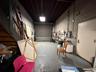 Garage with a workshop area and concrete block wall