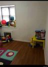 Game room with baseboards and dark wood-style floors