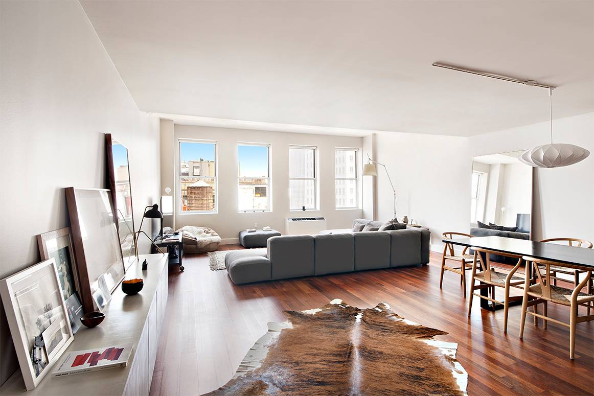 Elegant 21st floor prewar three bedroom loft with 16 windows featuring dramatic city and Hudson River views.