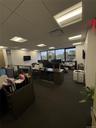 Office space with a paneled ceiling