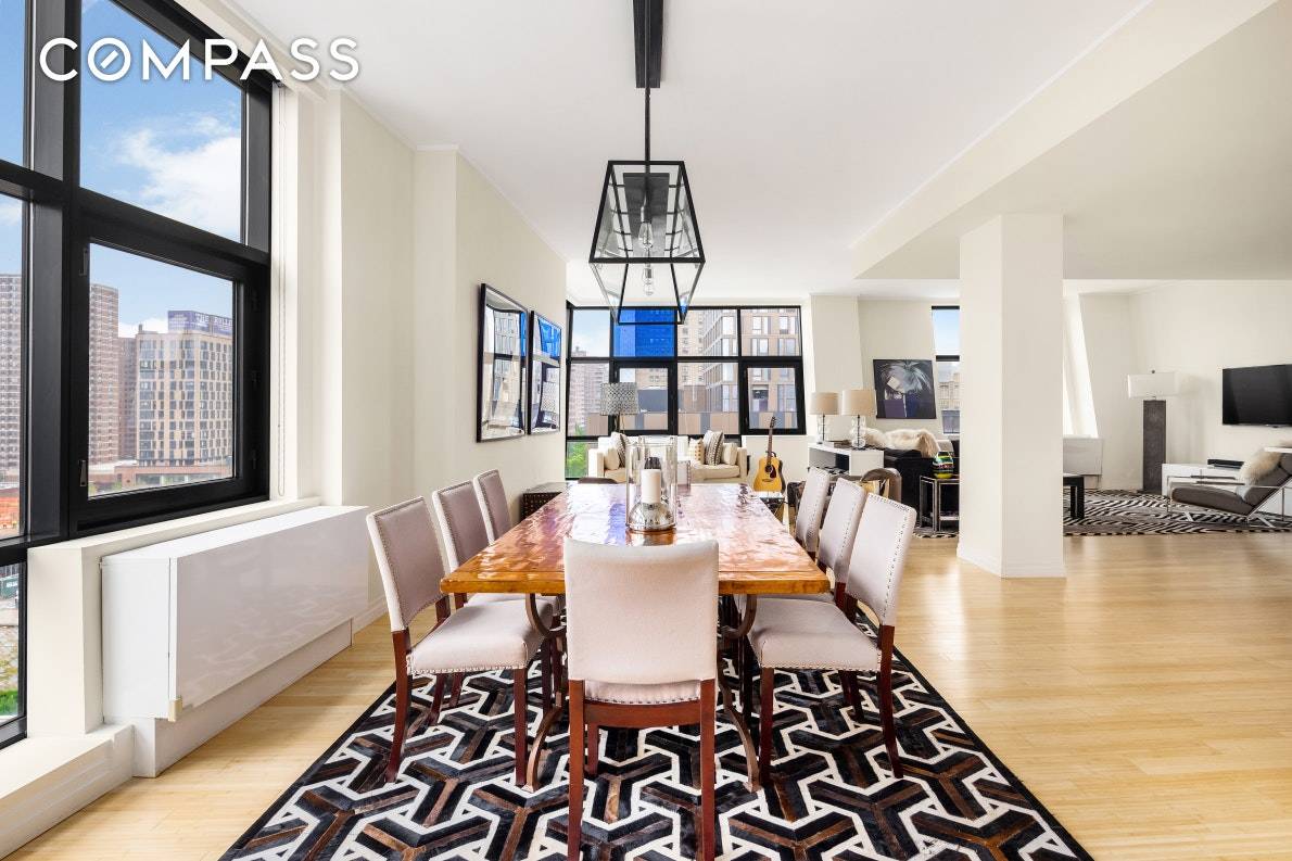 This spectacularly bright loft like residence features wraparound windows and 10 foot ceilings.