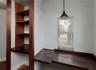 Record room or library with built-in wooden shelves & two built-in desks.