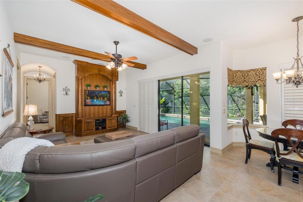 Family Room with wood beamed ceiling accents