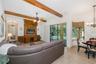 Family Room with wood beamed ceiling accents