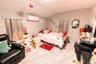 Bedroom featuring vaulted ceiling and marble finish flooring