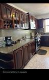 Cocina con gabinetes de madera / Kitchen with wood cabinets