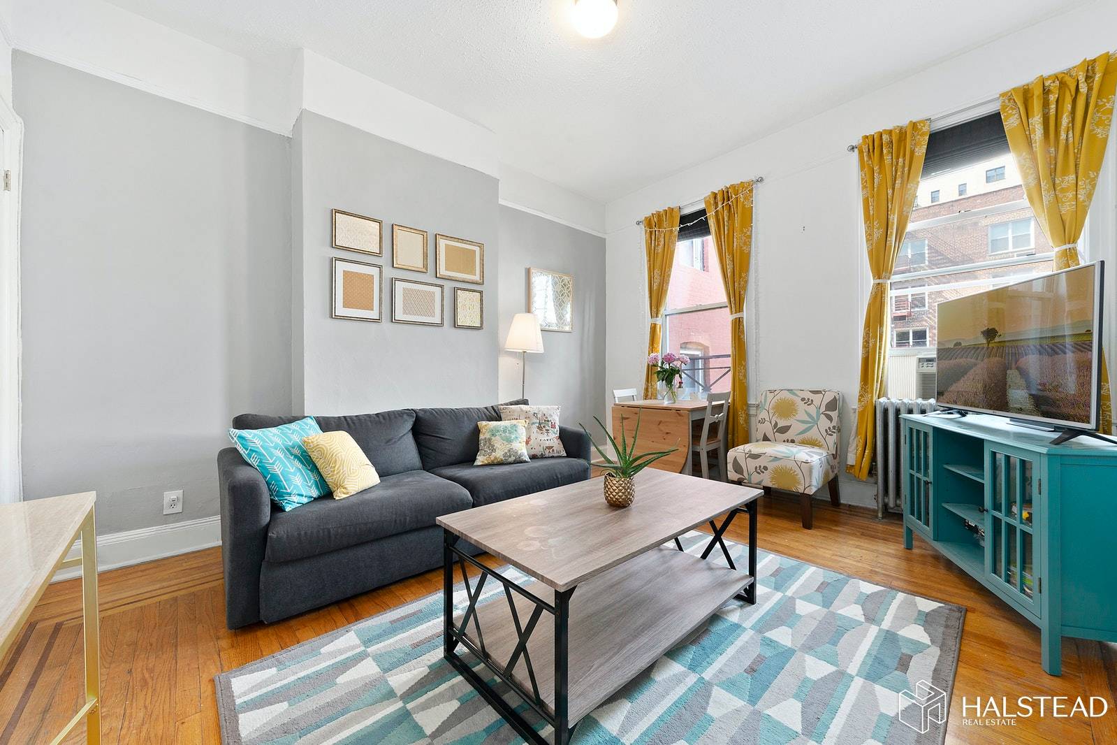 Beautiful Landmark SoHo Townhouse 2 bedroom 1 bath featuring original moldings and details, hi ceilings, walnut wood floors, sunny north and south exposures, a separate eat in kitchen has a ...