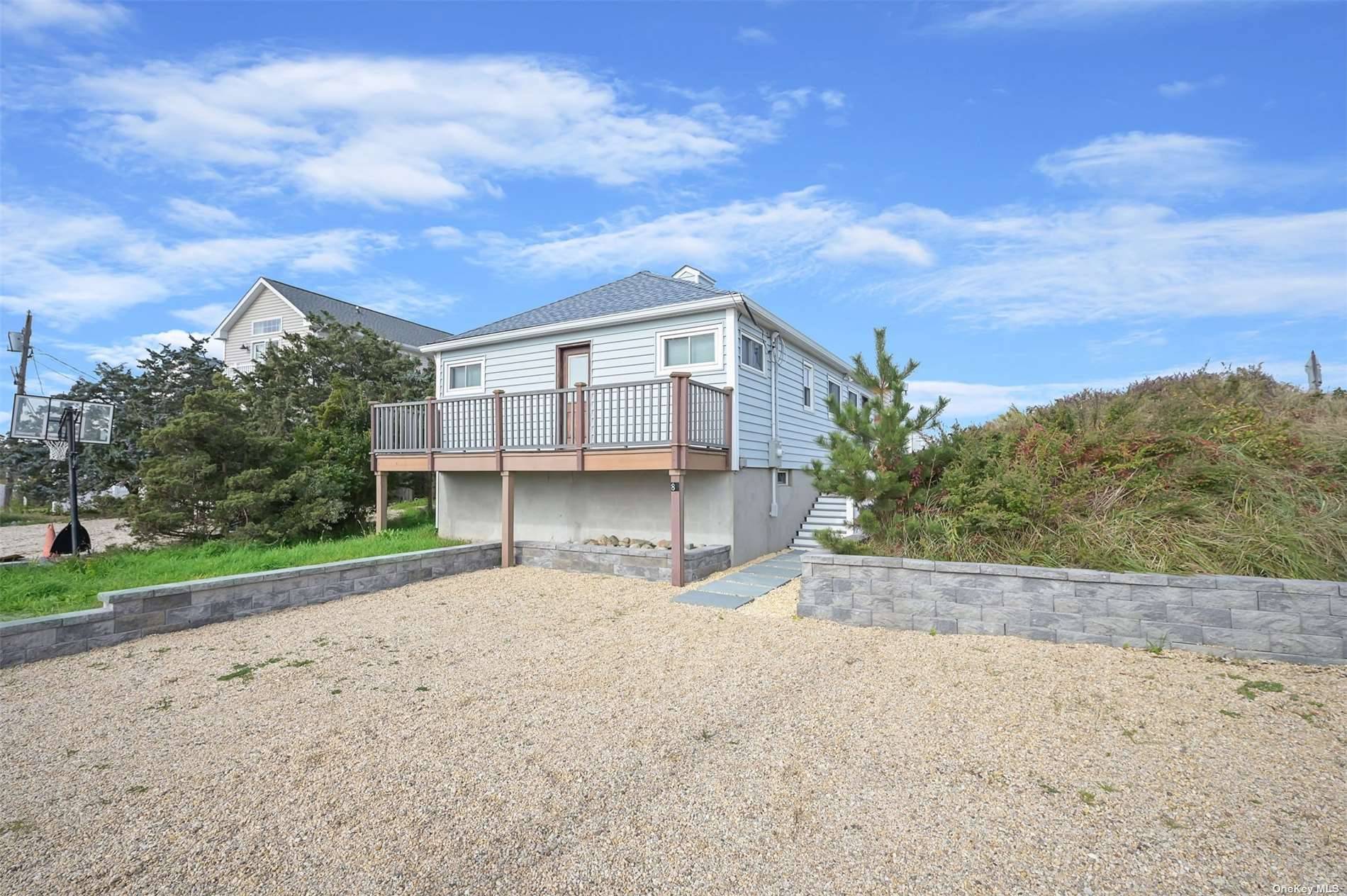 Welcome to this stunning beachfront property on the Sound !