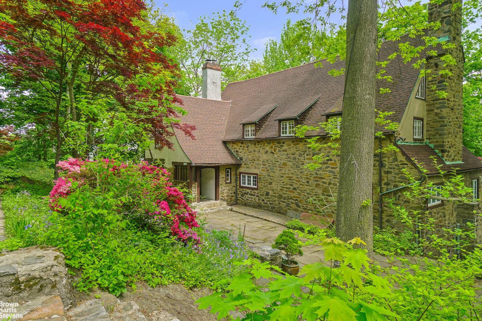 An elegant 1930's Medieval Revival home designed by noted architect Frank J Forster and later updated by Dwight James Baum.