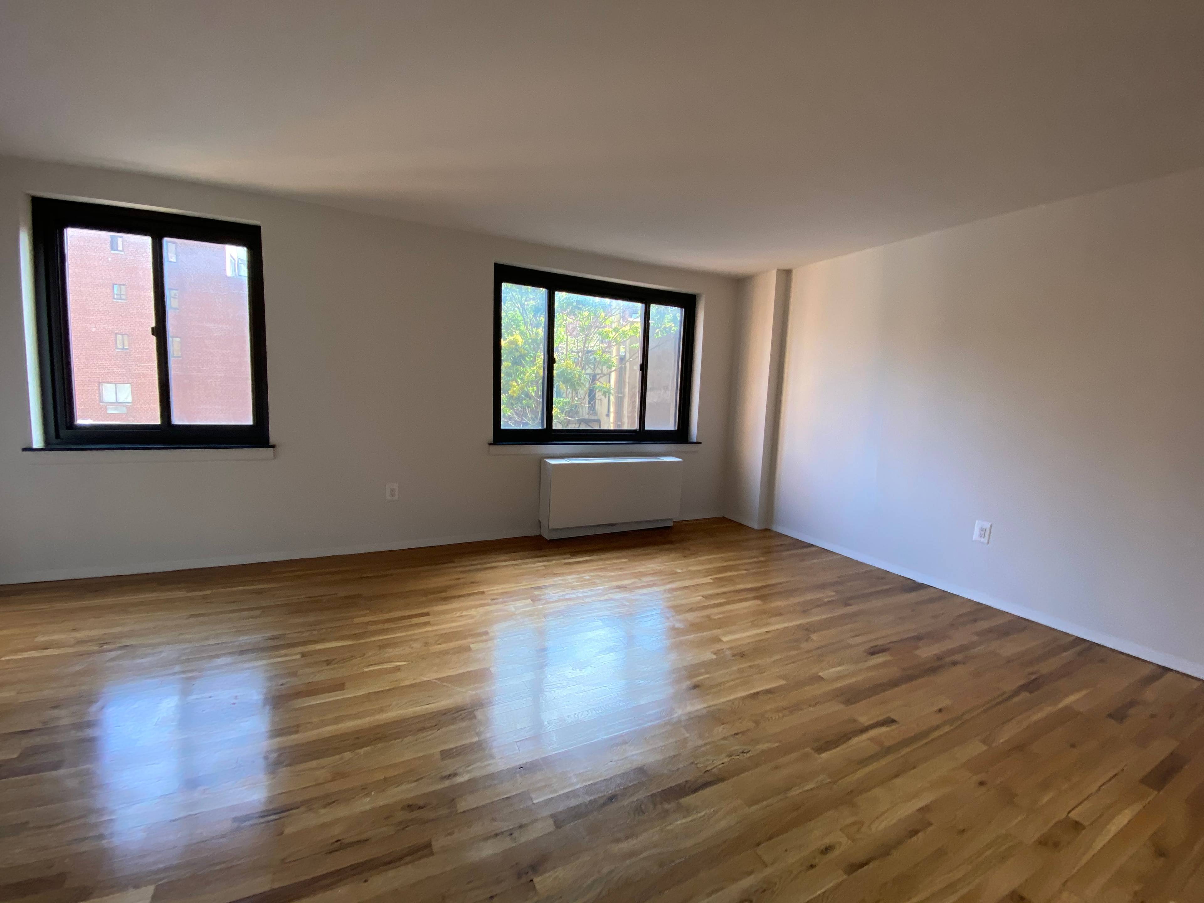 Spacious Alcove Studio Unit Beautiful oak flooring, granite countertops, stainless steel appliances with a dishwasher and a marble bathroom with over sized medicine cabinets.