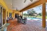 Expansive Covered & Screened Lanai with Paver Pool Deck