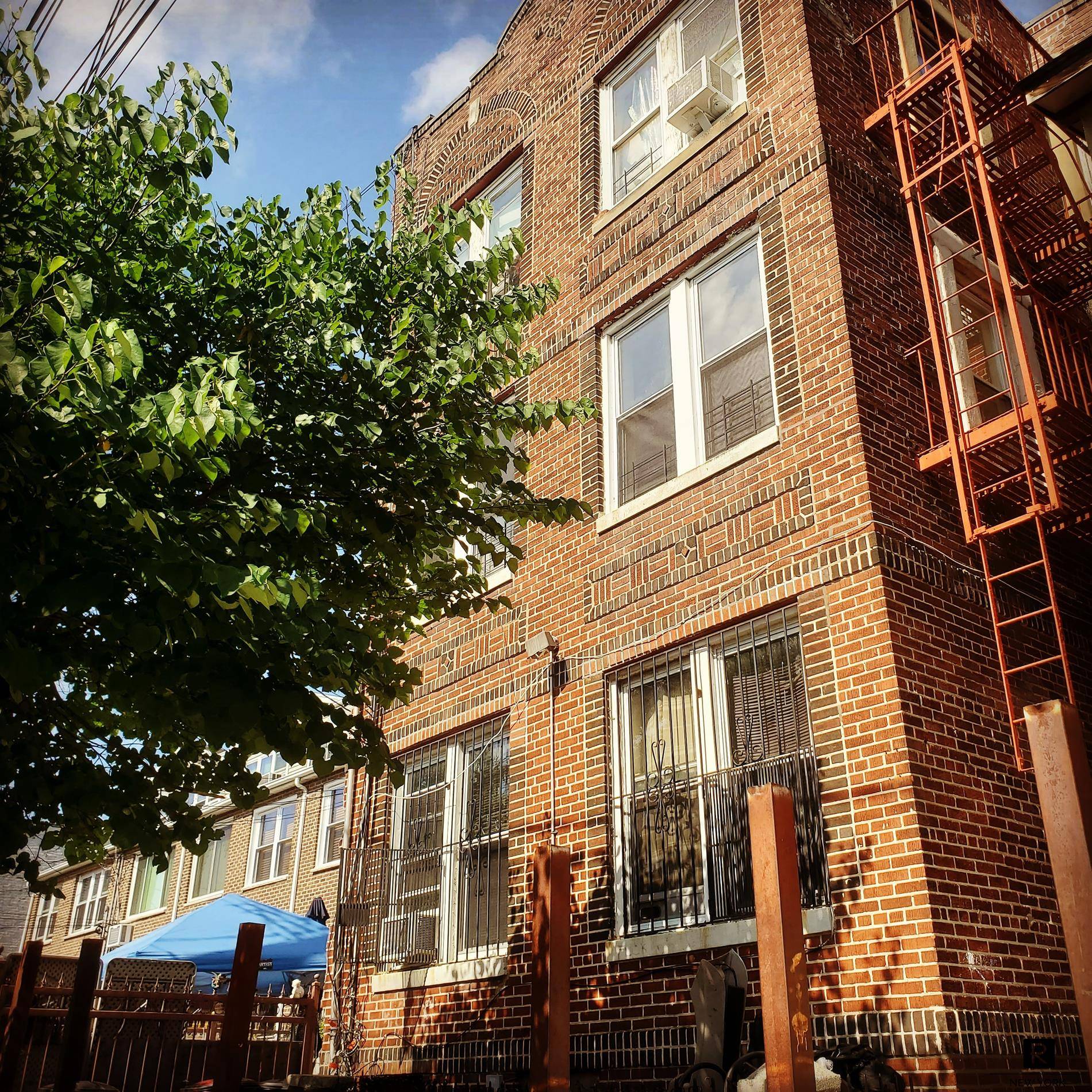 lovely Six Family Brick Townhouse with 6 Spacious Apartments and a Basement !