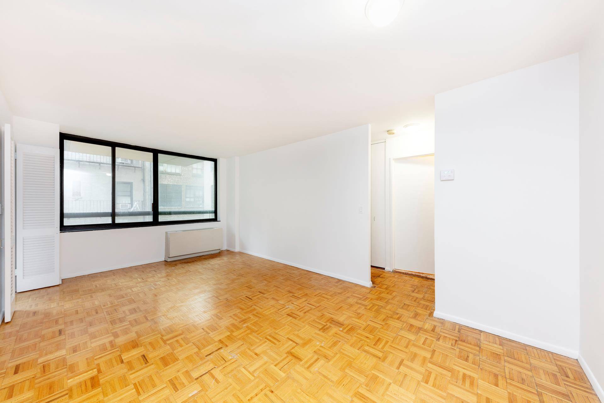 Converted 1 BR for rent in full service building !