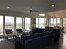 Living area featuring a chandelier, recessed lighting, lofted ceiling, and ceiling fan