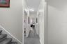 Hallway view connecting bedrooms and living spaces.