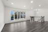 Living Room & Foyer with recessed lighting, a baseboard radiator, and dark wood finished floors