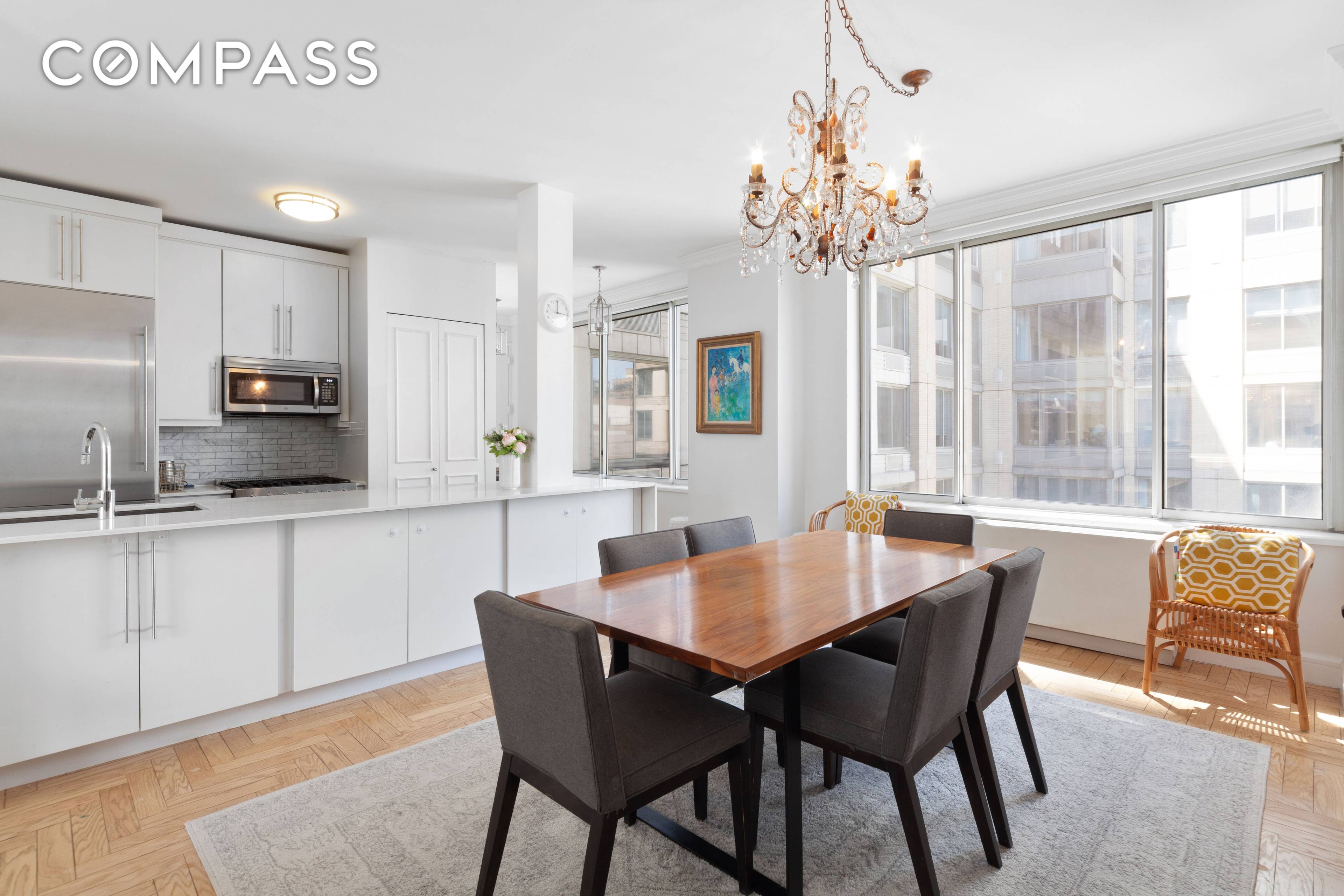Waterside living is easy in this pristine, sun splashed two bedroom, two bathroom residence in a white glove contemporary condominium on Riverside Park South.