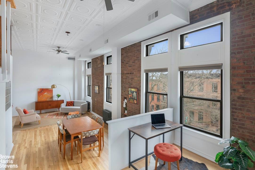 A rare pre war loft in Park Slope with wide open views of Manhattan, Brownstone Brooklyn and sky, located at the corner of 6th Avenue and St.