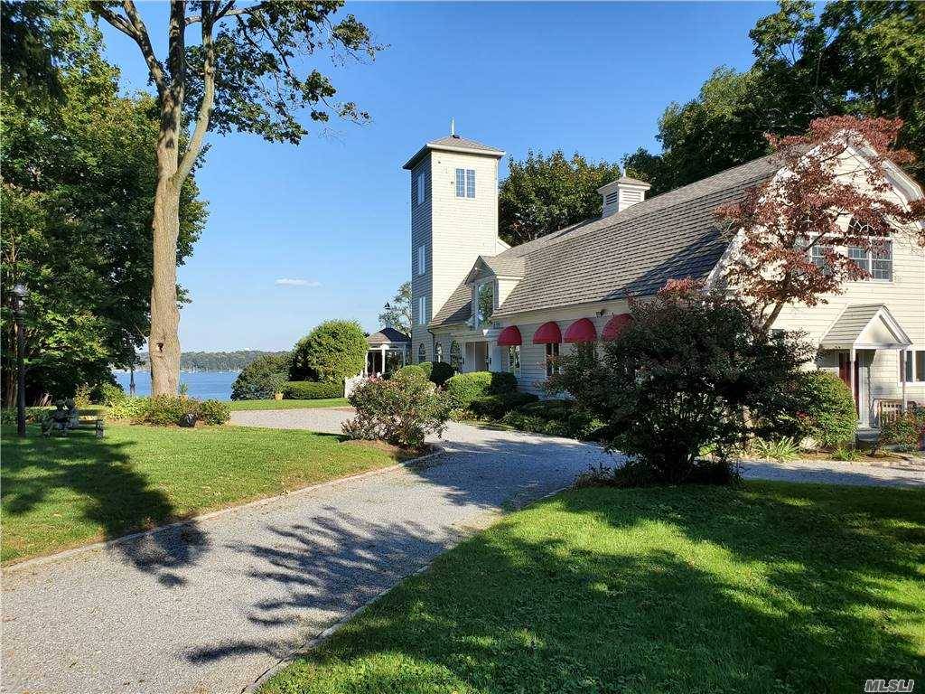 Iconic Waterfront Living An historic barn masterfully readapted for modern day living, ideally sited at the end of a cul de sac, on 1.