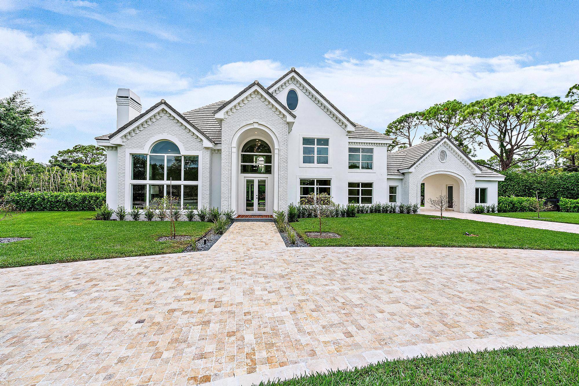 Elevate your lifestyle in this completely renovated masterpiece located in the heart of Palm Beach Gardens' highly sought after gated community, Steeplechase.