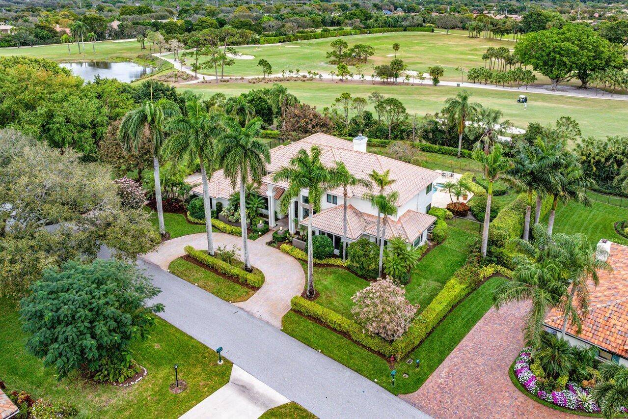 This magnificent estate home located at 10438 Prestwick Rd in Boynton Beach is truly a one of a kind property.