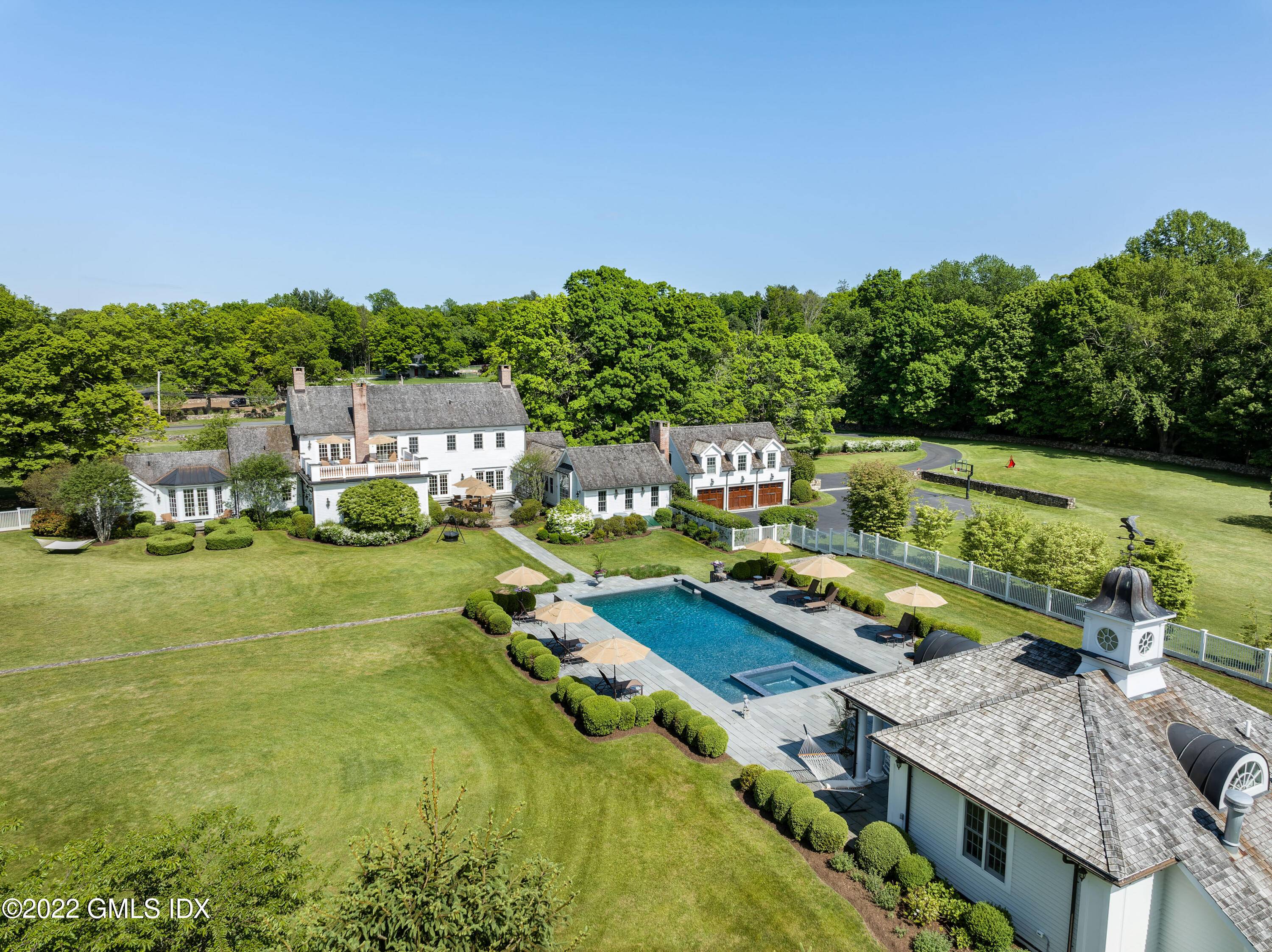 Welcome to 229 Umpawaug Road, the quintessential estate of exceptional quality on the premier scenic road in Redding, Connecticut.