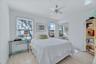 First floor full size bedroom with ceiling fan