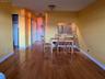 Dining area with sink and light wood-type flooring