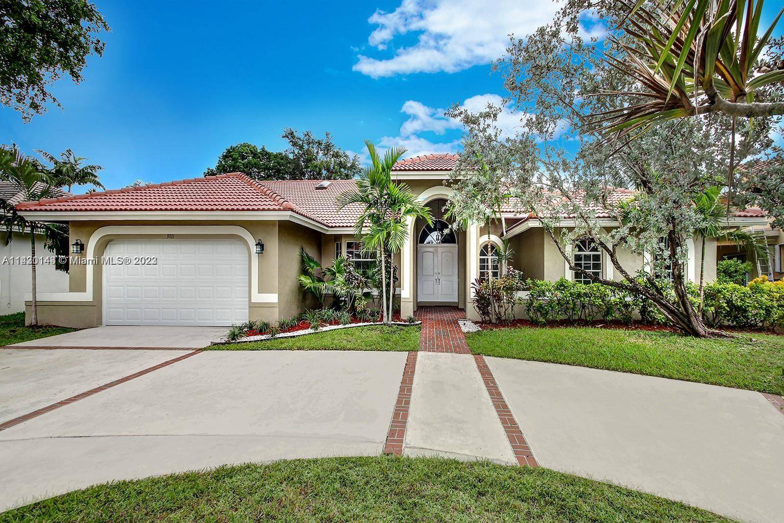 Beautiful home located in the desirable Jacaranda Country Club, Plantation.