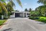 Take a look at this concrete oversized driveway and much needed carport with an entrance door to home. This carport includes an electric car charger.