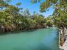 Unique natural bayou provides protection, a fish sanctuary, and access to the Gulf just a few homes away.