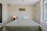 Bedroom 3 featuring an expansive window, a built-in window ledge, and light-toned walls