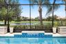 Poolside Waterfall with Peaceful Pond Views