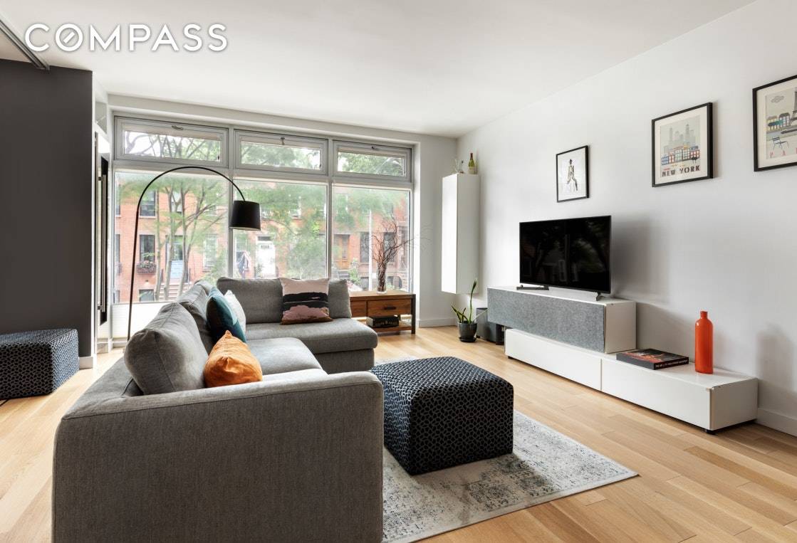Welcome home to this turnkey condo on a charming South Slope street.