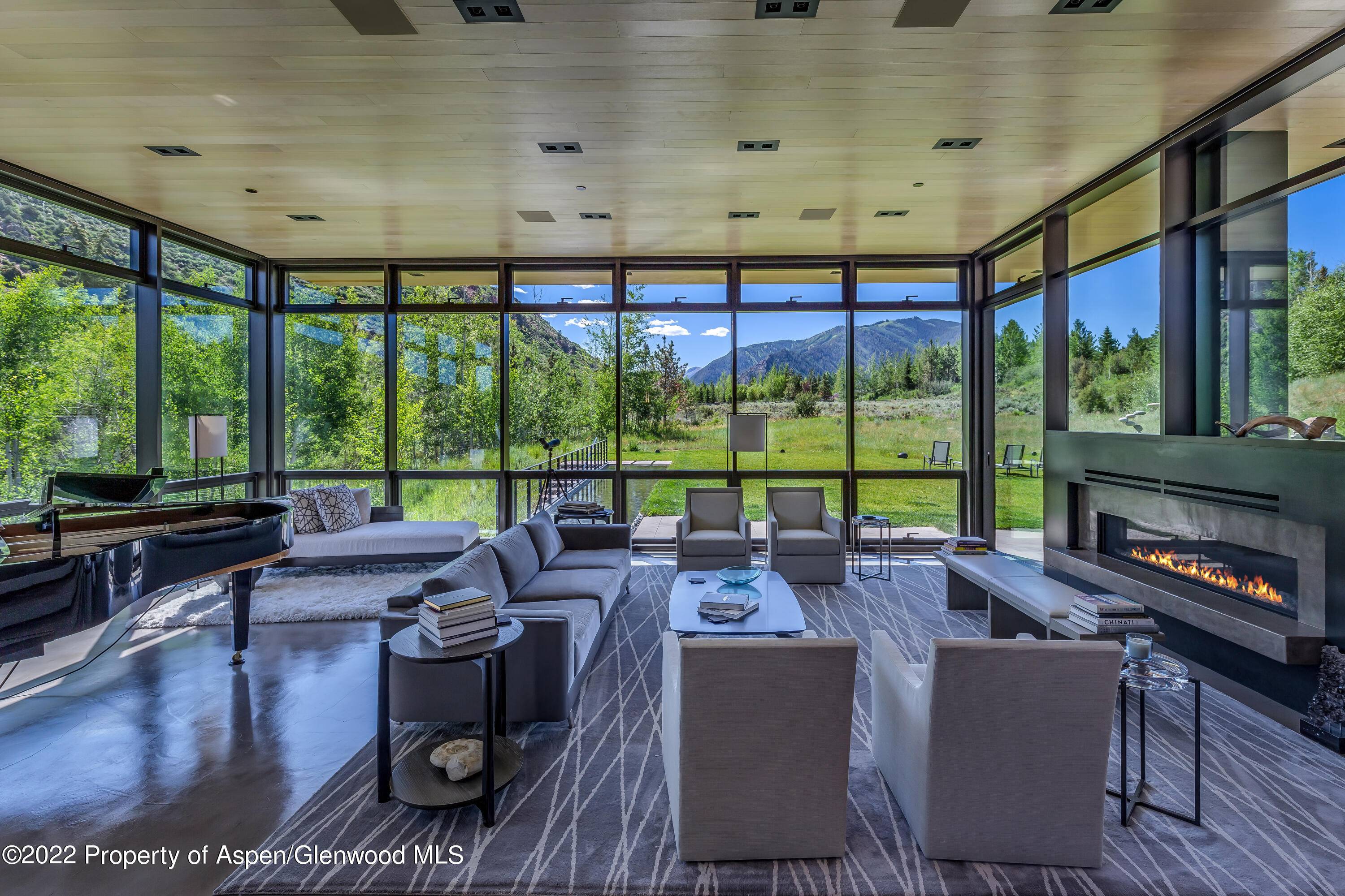 This stunning 7 bedroom contemporary home overlooking Maroon Creek offers almost 12, 000 square feet of living space and represents the best of the best !