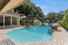 Infinity Pool and Spa. Decorative planters and two natural gas fed fire pit features complete the luxury pool experience