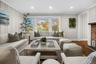Newly renovated living room featuring a large bay window that fills the space with natural light for an inviting, relaxed atmosphere.