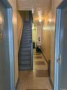 Staircase with tile patterned floors