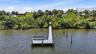 Enjoy watching the boats cruise along from your newer dock on the Bay