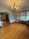 Large dining room between living room and kitchen.Hardwood floors.