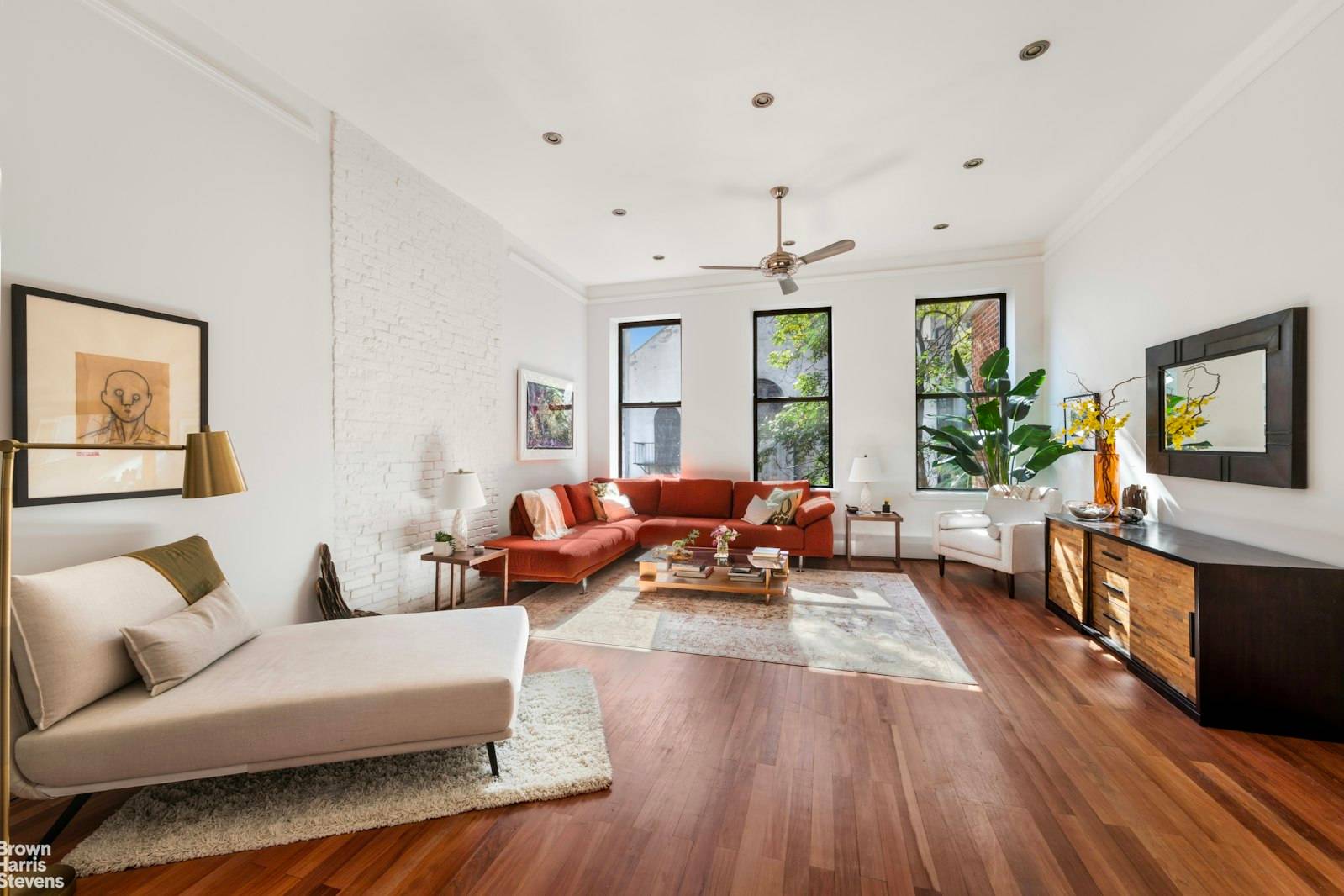 Discover the epitome of refined urban living in this renovated beautiful and sunny half house condo perched on a quiet tree lined street in fantastic South Harlem.