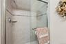 Bathroom featuring a shower stall
