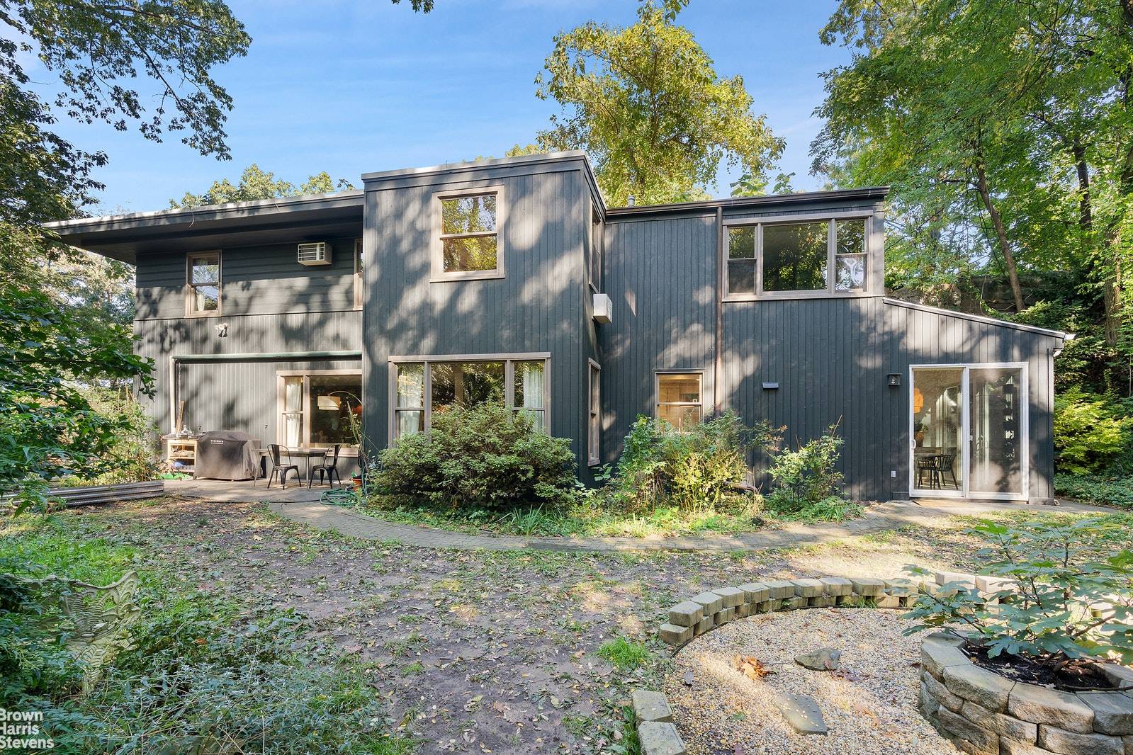 5998 Palisade Avenue is a four bedroom, two and a half bath house nestled beautifully into the distinctive hills of North Riverdale, cloistered by 40ft rock formations.