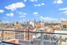 Balcony featuring a skyline view